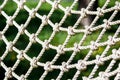 White net in the rope adventure park in the summer. Close up. Active sport life