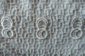 White netlike retro styled openworked lace fabric