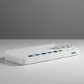 White network hub or router with sleek, rectangular design sitting on a flat surface. Royalty Free Stock Photo