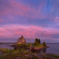 White Night On The White Sea Coast. Village Rabocheostrovsk, Republic Of Karelia. Old Russian Orthodox Wooden Church On Island