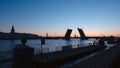 WHITE NIGHTS: Silhouette of Kunstkamer, Palace Bridge and embankment of the Neva river - St. Petersburg, Russia Royalty Free Stock Photo