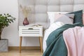 White nightstand in pastel bedroom