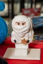 White ninja lego mini figure on birthday cake