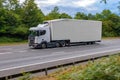 White no name double decker lorry in motion on the motorway. Royalty Free Stock Photo