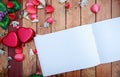 White note book and red heart box with flower petals decorative on wooden table. background for valentines day concept Royalty Free Stock Photo