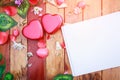 White note book and red heart box with flower petals decorative on wooden table. background for valentines day concept Royalty Free Stock Photo