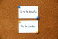 White note on cork board with message If it doesn`t challenge you It doesn`t change you