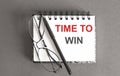 White note with inscription time to win on gray background . Business concept Royalty Free Stock Photo