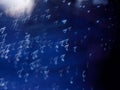 White note shape bokeh on a dark blue background, Abstract shining musical note shape bokeh Royalty Free Stock Photo