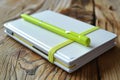 White notebook with a bright neon green pen creating a striking contrast and vibrant look Royalty Free Stock Photo