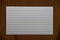 White notecard on wood table