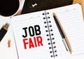 White notepad and ink pen on the wooden desk Job Fair Concept Royalty Free Stock Photo