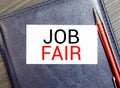 White notepad and ink pen on the wooden desk Job Fair Concept Royalty Free Stock Photo