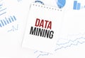 White notepad with text DATA MINING on the financial documentation. Finance and business concept Royalty Free Stock Photo