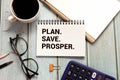 white notepad and text Plan. Save. Prosper. Royalty Free Stock Photo