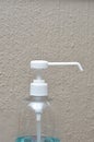 A white nozzle on a plastic bottle