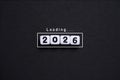 White number cubes forming 2026 with a loading text concept symbolize the upcoming new year future planning progress anticipation Royalty Free Stock Photo