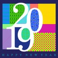 2019 white numerals designed with random colorful patterns with Happy New Year text