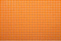 White nylon mesh on orange background.