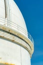 white observatory building and ladder with blue sky Royalty Free Stock Photo