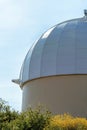 white observatory dome in shade with folliage Royalty Free Stock Photo