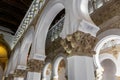 White octagonal pillars and arcades with golden floral capitals in the Synagogue of Santa Maria la Blanca, Toledo, Spain