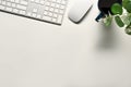 White office desk with keyboard, mouse and coffee cup. Top view with space for text Royalty Free Stock Photo