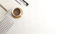 White office desk table with blank notebook, computer, supplies and coffee cup. Royalty Free Stock Photo