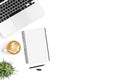 White office desk table with blank notebook, laptop computer, cup of coffee and supplies. Top view with copy space, flat lay Royalty Free Stock Photo