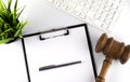 White office desk table with blank sheet, keyboard and gavel, top view Royalty Free Stock Photo