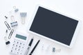 White office desk table with calculator, tablet and other office supplies. Top view. Royalty Free Stock Photo