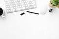 White office desk table with computer gadgets and office supplies. Top view with copy space, flat lay Royalty Free Stock Photo