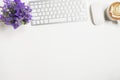 White office desk table with computer keyboard, mouse, and cup of coffee. Top view with copy space, flat lay Royalty Free Stock Photo