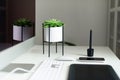 White office desk table with computer keyboard, mouse, monitor, graphic tablet, smartphone, succulent plant and other office Royalty Free Stock Photo