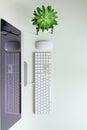 White office desk table with computer keyboard, mouse, monitor, succulent plant and other office supplies. Top view, copy space, Royalty Free Stock Photo