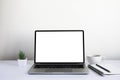 White office desk table with keyboard of laptop, coffee cup and notebook, mouse computer Royalty Free Stock Photo