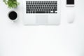 White office desk table with laptop computer, coffee cup and supplies. Top view with copy space, flat lay Royalty Free Stock Photo