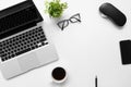 White office desk table with laptop computer, cup of coffee and office supplies. Top view with copy space, flat lay Royalty Free Stock Photo
