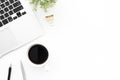 White office desk table with laptop computer, cup of coffee and supplies. Top view with copy space, flat lay Royalty Free Stock Photo