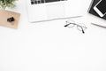 White office desk table with laptop computer, smartphone and supplies. Top view with copy space, flat lay Royalty Free Stock Photo
