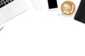 White office desk table with laptop, smartphone, coffee cup and supplies. Top view with copy space, flat lay Royalty Free Stock Photo