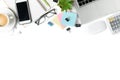 White office desk table with laptop, smartphone and supplies Royalty Free Stock Photo