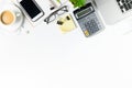 White office desk table with laptop, smartphone and supplies Royalty Free Stock Photo