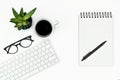 White office desk table layout. computer keyboard, glasses, coffee and pen. copy space. flat lay. Royalty Free Stock Photo