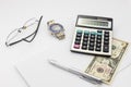 White office desk table with pen calculator glasses and banknote Royalty Free Stock Photo