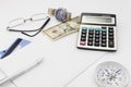 White office desk table with pen calculator glasses and banknote Royalty Free Stock Photo