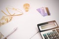 White office desk table with pen calculator glasses and banknote Royalty Free Stock Photo