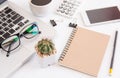 White office desk table, workspace office with laptop, smartphone black screen, coffee cup,pen,calculator, glasses, Top view with Royalty Free Stock Photo