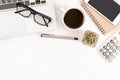 White office desk table, workspace office with laptop, smartphone black screen, coffee cup,pen,calculator, glasses, Top view with Royalty Free Stock Photo