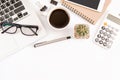 White office desk table, workspace office with laptop, smartphone black screen, coffee cup,pen,calculator, glasses, Top view with Royalty Free Stock Photo